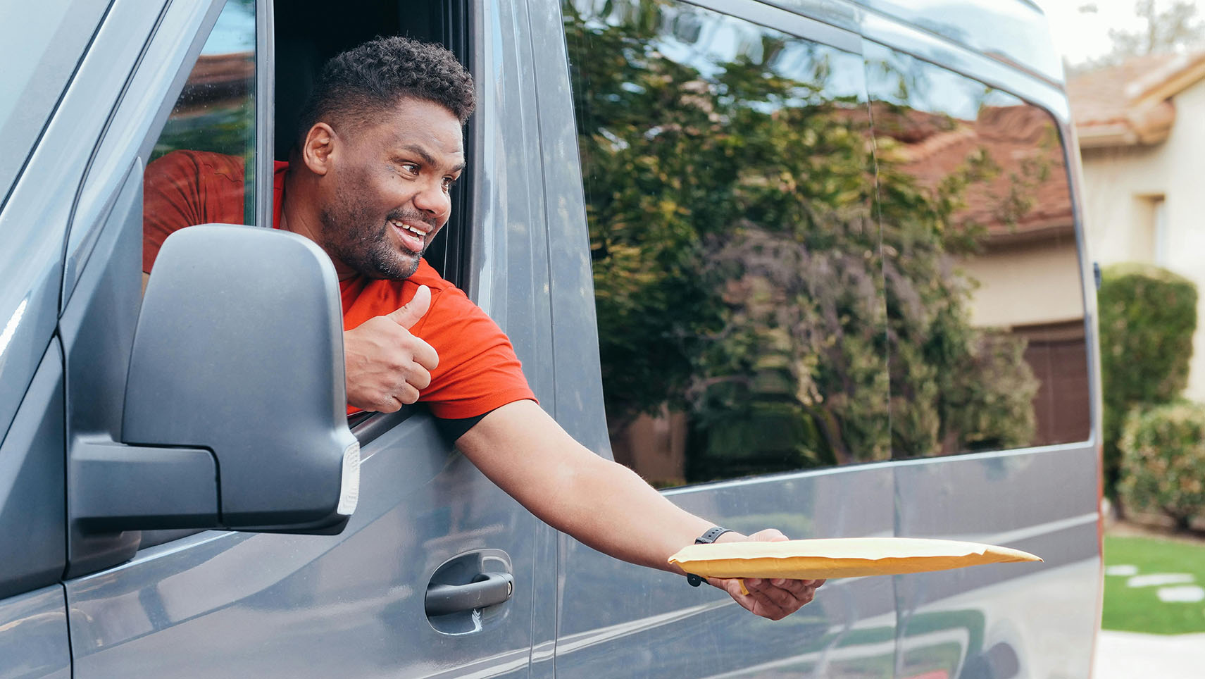 A Man Inside a Van Delivering a Parcel