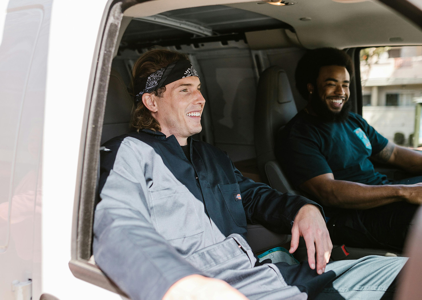 Movers in a Van Smiling